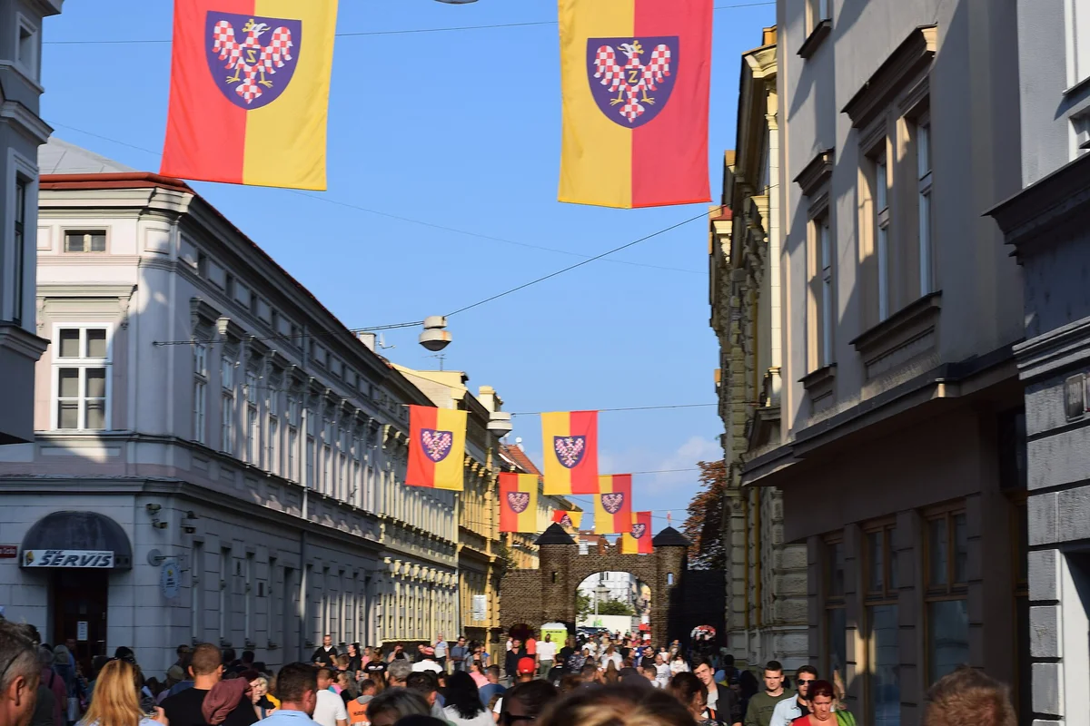 Znojemské historické vinobraní festival crowds and Znojmo flags in historic city centre