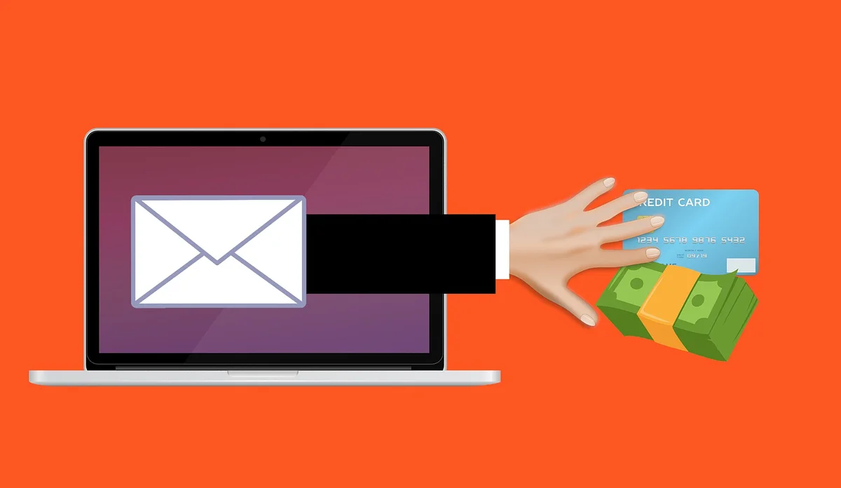 phishing podvod kybernetický útok — ruka kradnúca dáta z e-mailu