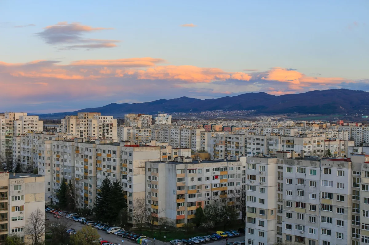 Sofia residential apartment blocks at sunset, property tax for foreign owners in Bulgaria
