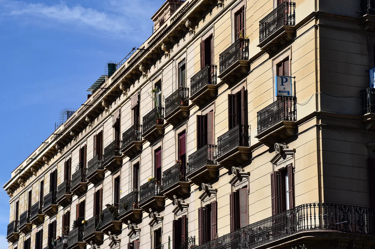 Classic Barcelona apartment building balconies for renting an apartment in Spain